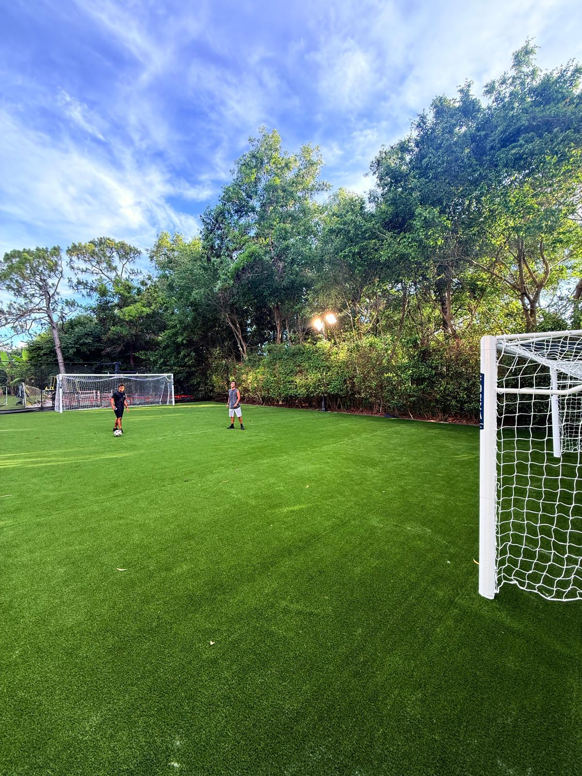 Finished artificial turf recreation field with soccer goals
