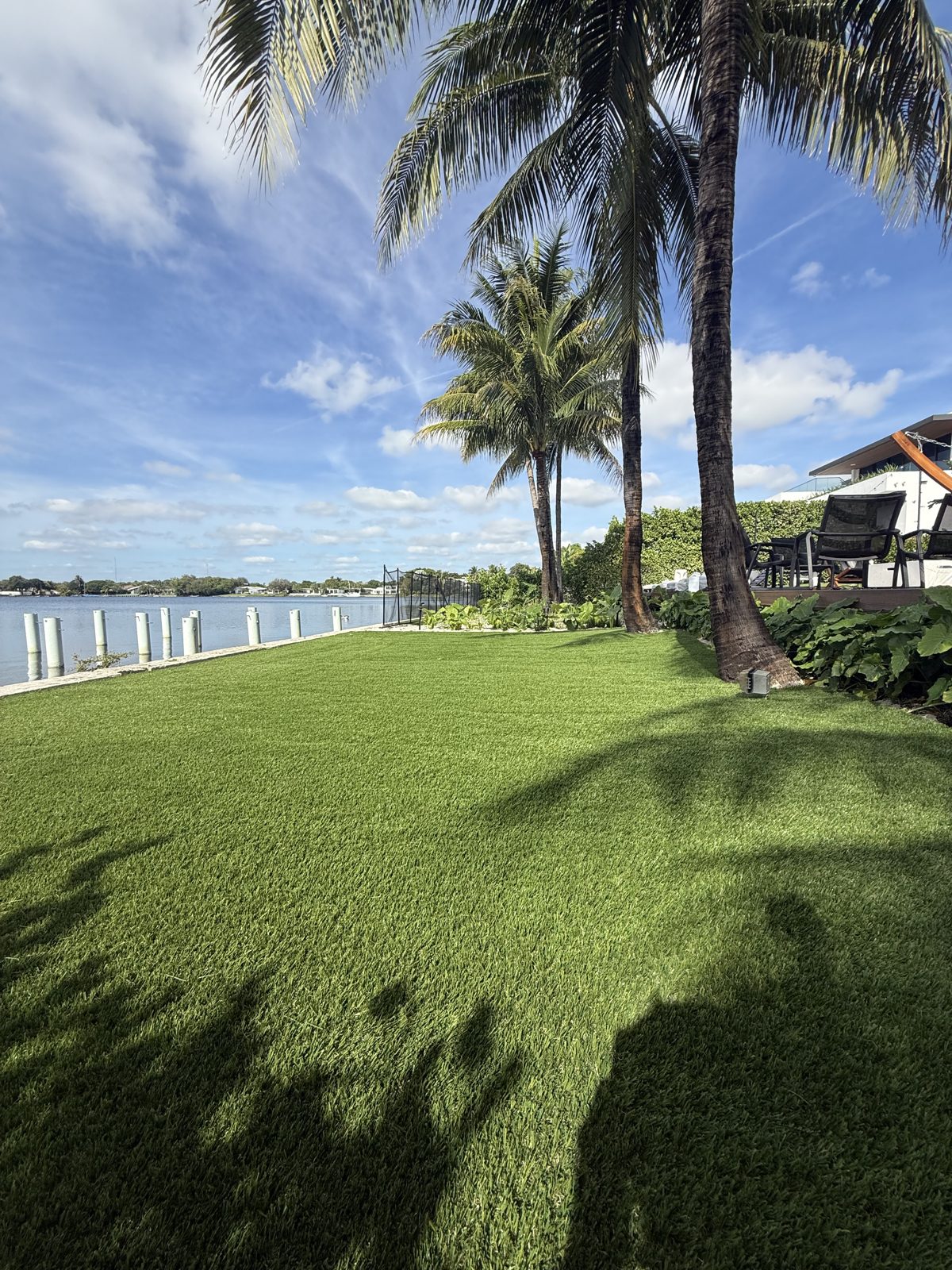 Finished artificial turf lawn at a South Florida waterfront home